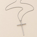 STÉPH Lumi Cross zilver hoofd op warm beige achtergrond